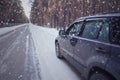 Winter drive car in winter forest