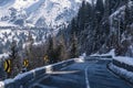 Winter Driving - Winter country road road through a mountains landscape