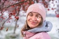 Winter Elegance: Portrait of a Beautiful Girl in a Snowy European Village. Winter lifestyle portrait of cheerful pretty