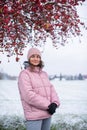 Winter Elegance: Portrait of a Beautiful Girl in a Snowy European Village. Winter lifestyle portrait of cheerful pretty