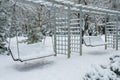 Winter empty park, swings in the snow. Royalty Free Stock Photo