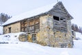 Winter evening landscape in french Alps. Old stone abandoned house on the mountain. Royalty Free Stock Photo