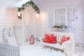 Winter exterior of a country house with Christmas decorations.