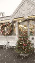 The winter exterior of a country house with Christmas ornaments Fir Wreath Snow