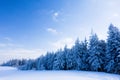 Winter fairytale forest landscape with snow covered trees and clear blue sky. Beskydy mountains