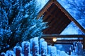 Winter fairytale landscape - Wooden house with warm light in night snowy winter forest, big size Royalty Free Stock Photo