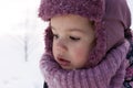 Winter, family, childhood concepts - close-up portrait authentic little preschool minor girl in pink look around in Royalty Free Stock Photo