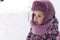 Winter, family, childhood concepts - close-up portrait authentic little preschool minor girl in pink look around in Royalty Free Stock Photo