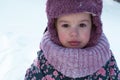 Winter, family, childhood concepts - close-up portrait authentic little preschool minor 3-4 years girl in pink hat look Royalty Free Stock Photo