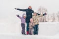 Winter family portrait. Mom with three daughters are walking in the park. Family laughing outdoors. Enjoying nature, wintertime Royalty Free Stock Photo