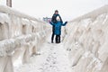 Winter family walk at Darlowo beach Royalty Free Stock Photo