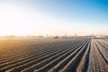 Winter farm field ready for new planting season. Agriculture and agribusiness. Preparatory agricultural work for spring. Choosing Royalty Free Stock Photo