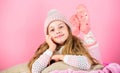 Winter fashion accessory. Kid girl knitted hat and scarf. Winter accessory concept. Girl long hair dream pink background Royalty Free Stock Photo