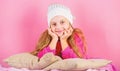 Winter fashion accessory. Kid girl knitted hat. Winter accessory concept. Girl long hair dream pink background. Kid Royalty Free Stock Photo