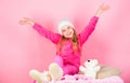 Winter fashion accessory. Kid girl knitted hat. Winter accessory concept. Girl long hair dream pink background. Kid Royalty Free Stock Photo