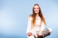 Sitting smiling woman wearing furry shoes Royalty Free Stock Photo