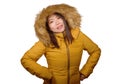 Winter fashion  portrait of young beautiful and happy Asian Chinese woman in warm yellow feather jacket with fur hood Royalty Free Stock Photo