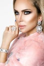 Winter Fashion Style. Beautiful Woman In pink Fur And Jewelry. Portrait Of Young Sexy Model With Beauty Makeup On Gorgeous Face In Royalty Free Stock Photo