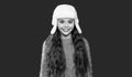 winter fashion for teen girl. winter knitwear. teen girl model in earflap hat. teen girl in hat Royalty Free Stock Photo