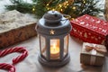 Winter festive concept, Christmas background. Lantern with candle, gifts and pine branches close-up. Selective focus Royalty Free Stock Photo