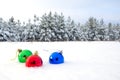 Winter festive landscape. Multicolored decorative balls on white snow. Christmas. New Year