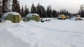 Winter field geological and geophysical camp in Siberia. Inflatable Rescue Living Tents. Tracked vehicles for working in difficult