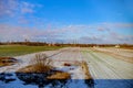 Winter field. On the horizon are visible wind power generators Royalty Free Stock Photo