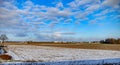 Winter field. On the horizon are visible wind power generators Royalty Free Stock Photo