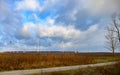 Winter field. On the horizon are visible wind power generators Royalty Free Stock Photo