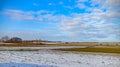 Winter field. On the horizon are visible wind power generators Royalty Free Stock Photo