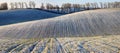 Winter field. picturesque hilly field Royalty Free Stock Photo