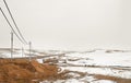 Winter field with power line columns Royalty Free Stock Photo