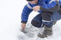 Winter fishing, a man on a winter river