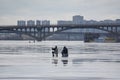 Winter fishers on the ice of frozen Dnipro river Royalty Free Stock Photo