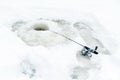 Winter fishing on ice. Jiggling bait in an ice hole. Relaxing in the wild Royalty Free Stock Photo