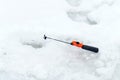 Winter fishing on ice. Jiggling bait in an ice hole. Relaxing in the wild Royalty Free Stock Photo