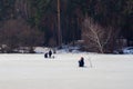 Winter fishing. River, lake near forest in ice. Anglers, Fishermens during your favorite leisure time. Copy space, for Royalty Free Stock Photo