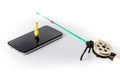 one small winter fishing rod and smartphone on white background. The concept of finding the right information