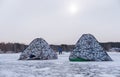 Winter fishing in Siberia - fisher`s tents on ice of Ob reservoir in Novosibirsk, Russia