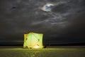 Winter fishing tent at night Royalty Free Stock Photo