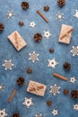 Winter flat lay with cinnamon, anise, cones, wooden snowflakes. Royalty Free Stock Photo