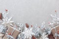 Winter flat lay with natural branches. leaves and presents on light background