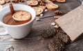 Winter flatlay with wholegrain cookies, cup of black tea and spices for mulled wine