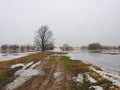 Winter flood in field, Lithuania Royalty Free Stock Photo