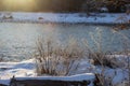 A frosty winter morning on a mountain river, the rays of the rising sun illuminate the panorama of the mountainous area. Royalty Free Stock Photo