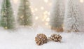 Winter forest with frosty fir trees falling snow pine cones golden garland bokeh lights. Christmas New Year greeting card poster Royalty Free Stock Photo