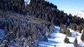 Winter forest and mountains. A group of tourists walking along the trail. The view from the top. Royalty Free Stock Photo