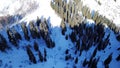 Winter forest and mountains. A group of tourists walking along the trail. The view from the top. Royalty Free Stock Photo