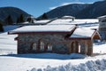 Winter forest scene. Small chapel at the mountain in a sunny winter day. Snowy fairytale in Bulgaria. Royalty Free Stock Photo