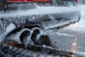 Winter freeze Frost coats the exhaust of a vehicle up close